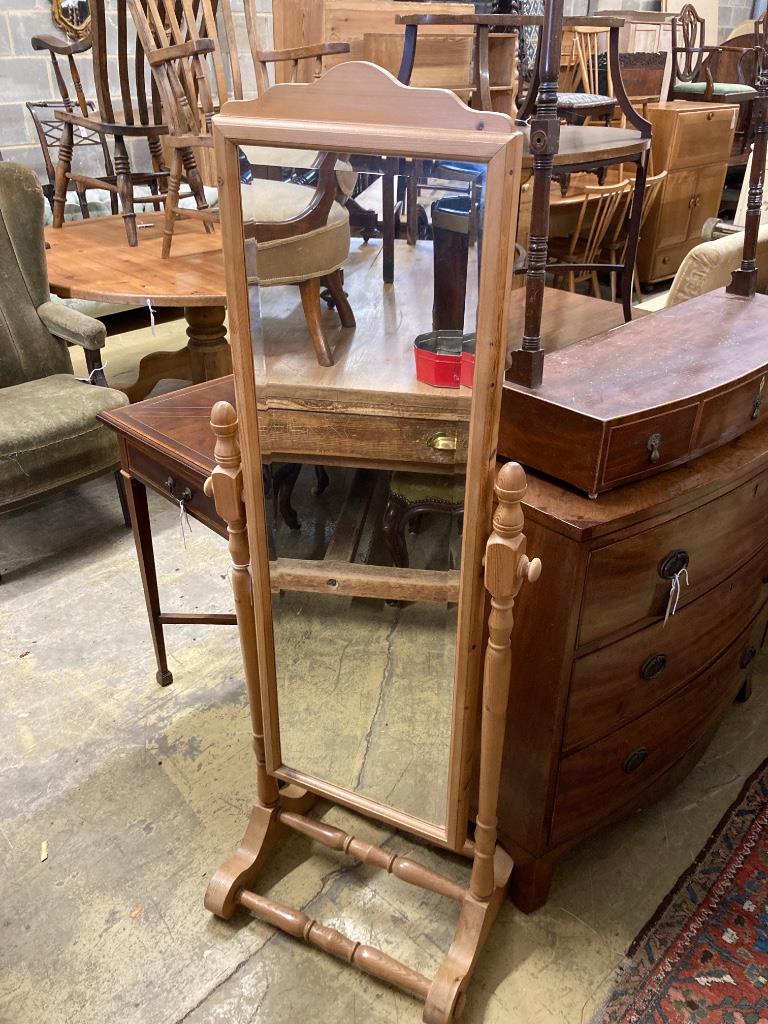 A reproduction pine cheval mirror, height 147cm